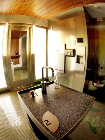 The bathroom sink, toilet seat made from recycled aluminum shavings at a gas station.