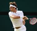 Federer of yore sets up prime time showdown with Djokovic