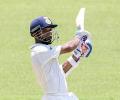 Rahane's century gives India big lead on rain-hit day