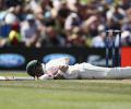 Smith earns praise after battling head knock to hit century