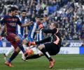 Espanyol put brakes on Barca, Atletico go top