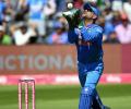 Twin world records for Dhoni in India's T20 win