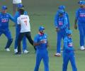 Run for a hug: Fan breaks security to embrace Dhoni