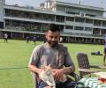 PICS: Kohli meets a cool cat during net practice