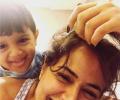 Video: Sameera Reddy nails motherhood like a pro!