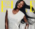 Is Naomi Campbell wearing just a T-shirt?