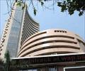 Markets open lower tracking global cues