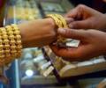 Gold extends losses, hits 20-month low; silver slips too