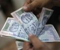 Rupee gains 13 paise to end at 1-week high against dollar