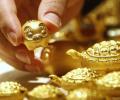 Gold jumps on US Fed's interest rate cut signal