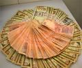 Massive dollar buying sinks rupee to all-time closing low