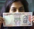 Rupee partially recovers after sinking below 56-mark