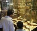 Gold falls on muted demand, silver shapes up on fresh buying