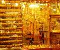 Gold falls on sluggish demand, global cues