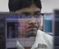 Sensex ends flat; banks soar, GAIL, RIL slip