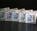 Rupee ends little changed; fund flows in focus