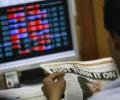 Markets end flat ahead of F&O expiry; Tata Motors top loser