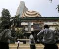 Sensex falls 97 pts, Nifty below 8,700 post RBI policy review