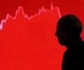 Market succumbs to late sell-off, ends lower