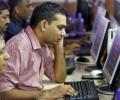 Sensex, Nifty edge lower on rupee woes, derivatives expiry