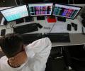 Sensex, Nifty pare gains; end in red