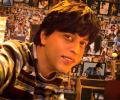 Whose posters do SRK, Salman paste on their walls?