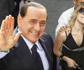 Scandal-hit Berlusconi to meet 'saintly' Dr Singh