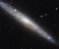 NASA captures pictures of dusty spiral galaxy