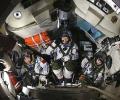 Chinese astronauts return to Earth after docking space lab