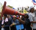 Thai protesters ignore PM's plea, cut power to police HQ