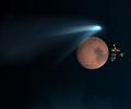 PHOTOS: Mountain-sized comet whizzes past Mars after a million years