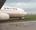 US aircraft with 173 on board slips off runway in Houston