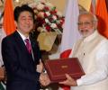 Modi, Japan's Shinzo Abe put bullet train on track, sign defence agreements