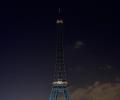 Photos: Eiffel Tower goes dark for Charlie Hebdo