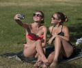 Europeans sweat and soak in sizzling summer