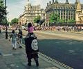 Man, child wave Islamic State flag outside UK Parliament