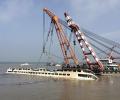 Chinese rescuers lift capsized cruise ship; toll crosses 100