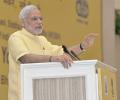 Yoga is a medium to check greed, violence: PM Modi