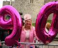 Portraits, gun salutes as Britain's Queen Elizabeth turns 90