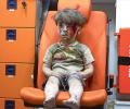 Brother of Syrian boy, pictured bloodied after air strike, dies