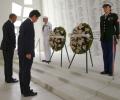 Wreaths and hugs: Japan's Abe offers sombre tribute at Pearl Harbor