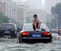 'Floods submerged my bed': 250 killed or missing in China rains