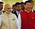 Why Xi is smiling and Modi isn't