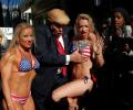 'Trump' takes Times Square with a band of bikini-clad babes