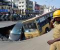 PHOTOS: Bus, car trapped in crater as Chennai road caves in