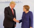 Trump shakes hands with Merkel