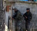 LeT terrorists holed-up in building, woman killed in encounter