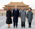 'King Xi' extends imperial welcome to Trump