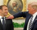 Trump brushes dandruff off 'perfect' Macron