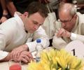 Pranab attends Rahul's Iftar, flanked by Congress chief all along